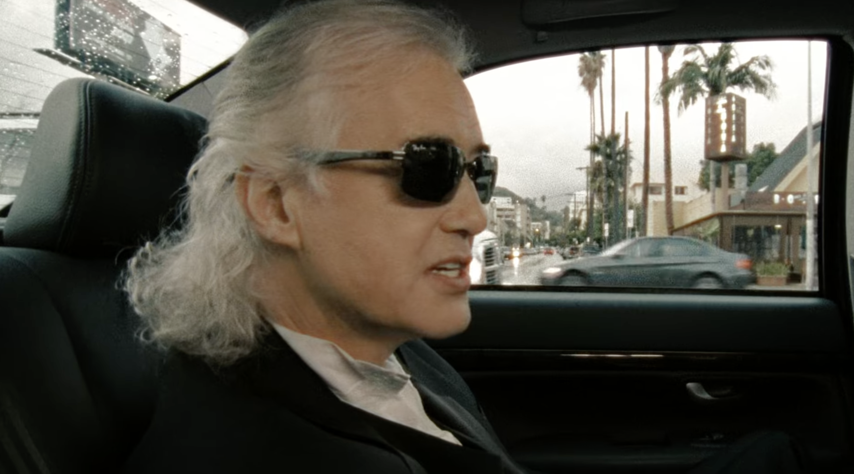 Jimmy Page wearing RayBans in a Limousine